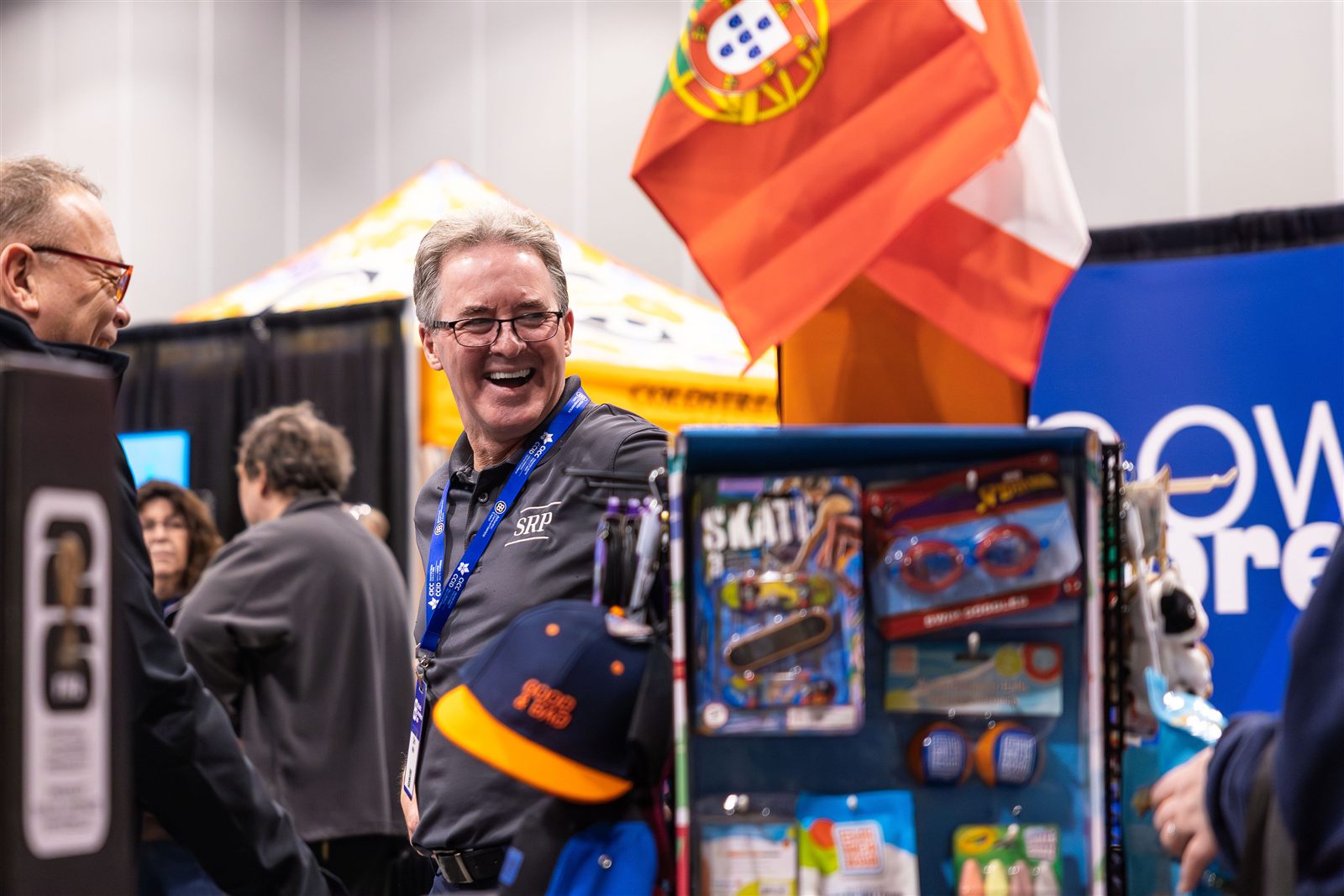 Exhibitors sharing a laugh with attendees at an ACE booth